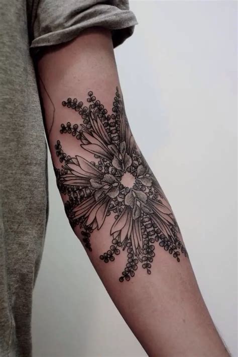 Traditional elbow tattoos look good with various themes, such as flower tattoos, bones, arrow design tattoos, geometric shapes, tribal tattoo. . Inner elbow tattoo